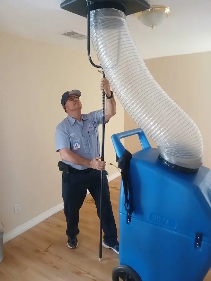 Furnace Tune-Up technician using HEPA equipment in Verona